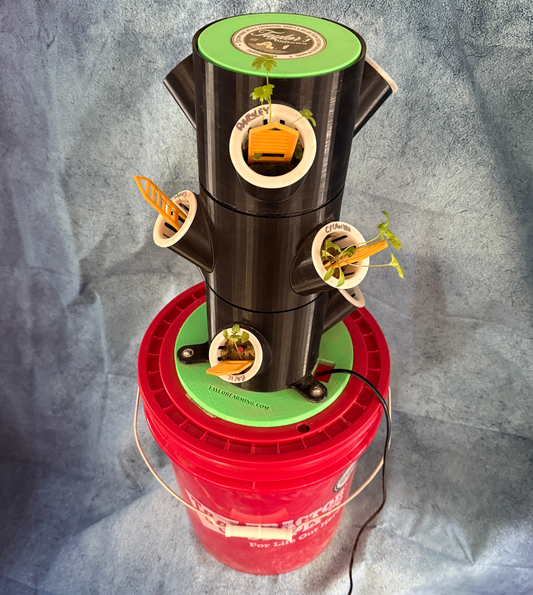 Vertical hydroponic garden system on a red bucket against a gray background