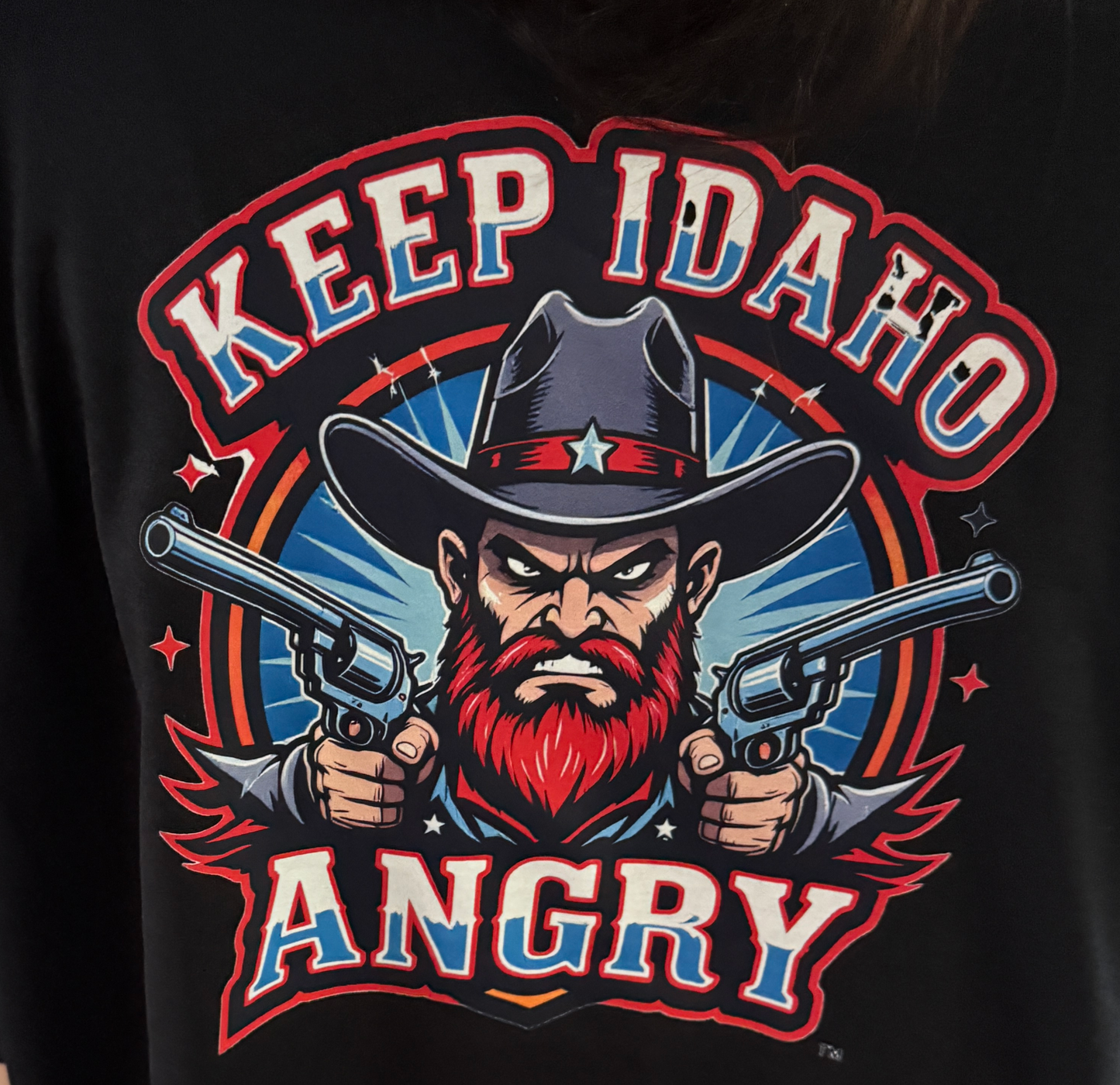 Keep Idaho Angry Tee with gunslinger graphic and bold text on black shirt