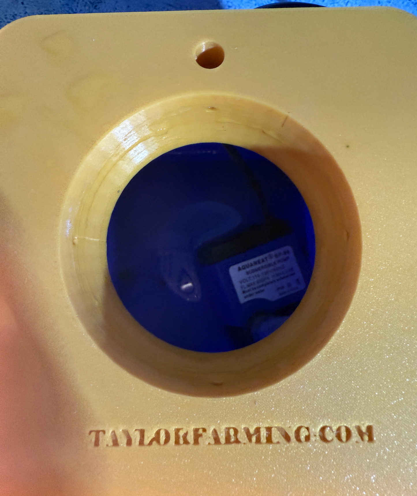 Veggie Pod Home Hydroponic Unit by Taylor's Oldtown Farmhouse yellow lid close-up showing planting pod and internal pump.