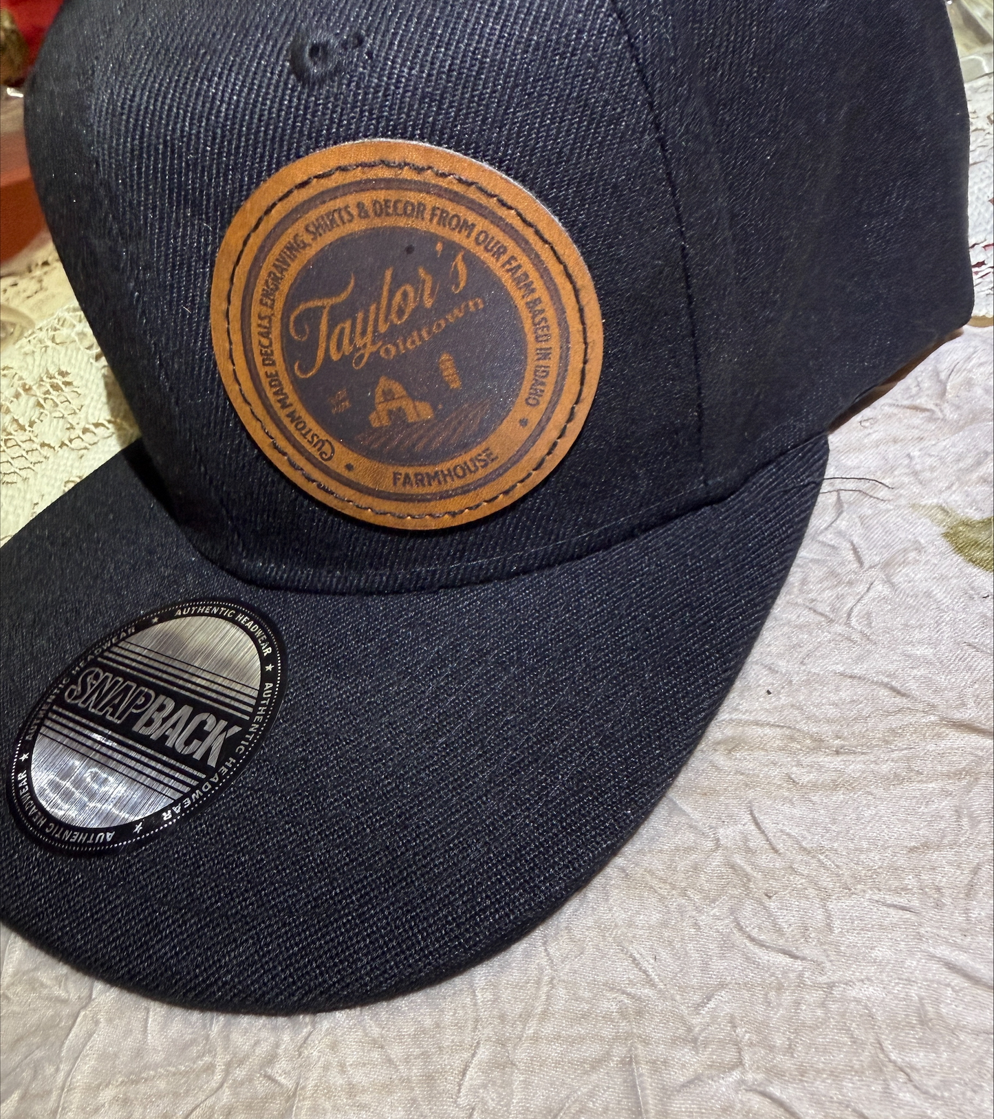 Black Flatbill Snapback Hat with Custom Faux Leather Patch