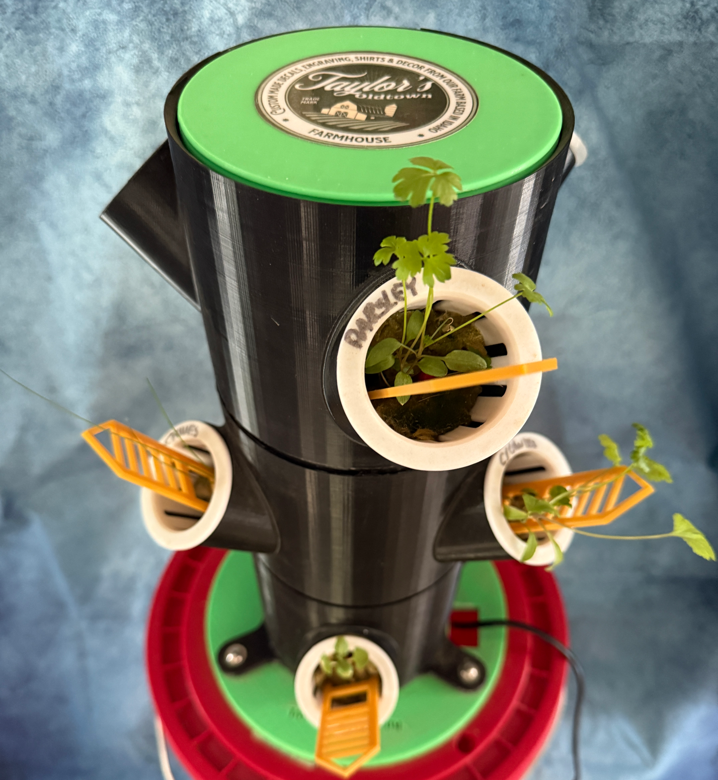 Tower garden with plants on a blue background